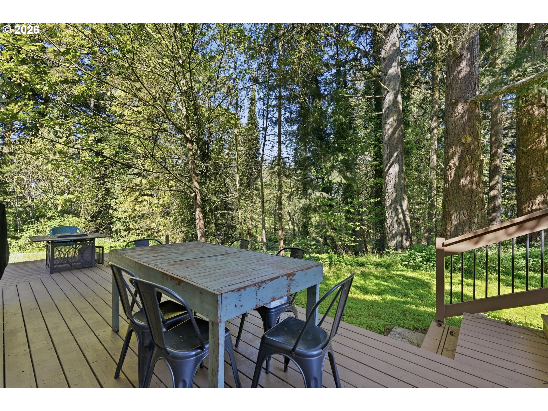 23032 Northeast Hagey Road Dundee, OR 97115 - Photo 36 of 42 a view of a patio with table and chairs with wooden floor and fence