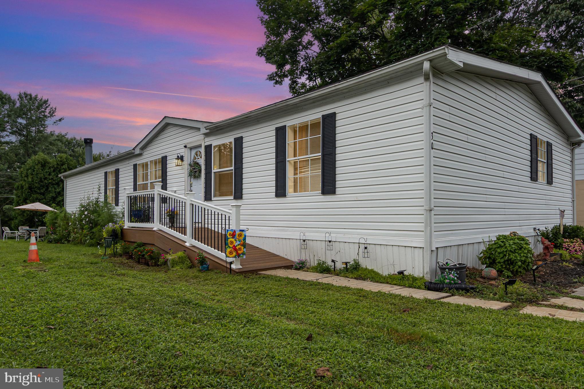 4041 Conowingo Road, Unit 30 Darlington, MD 21034 - Photo 1 of 40 a view of a house with a yard and sitting area