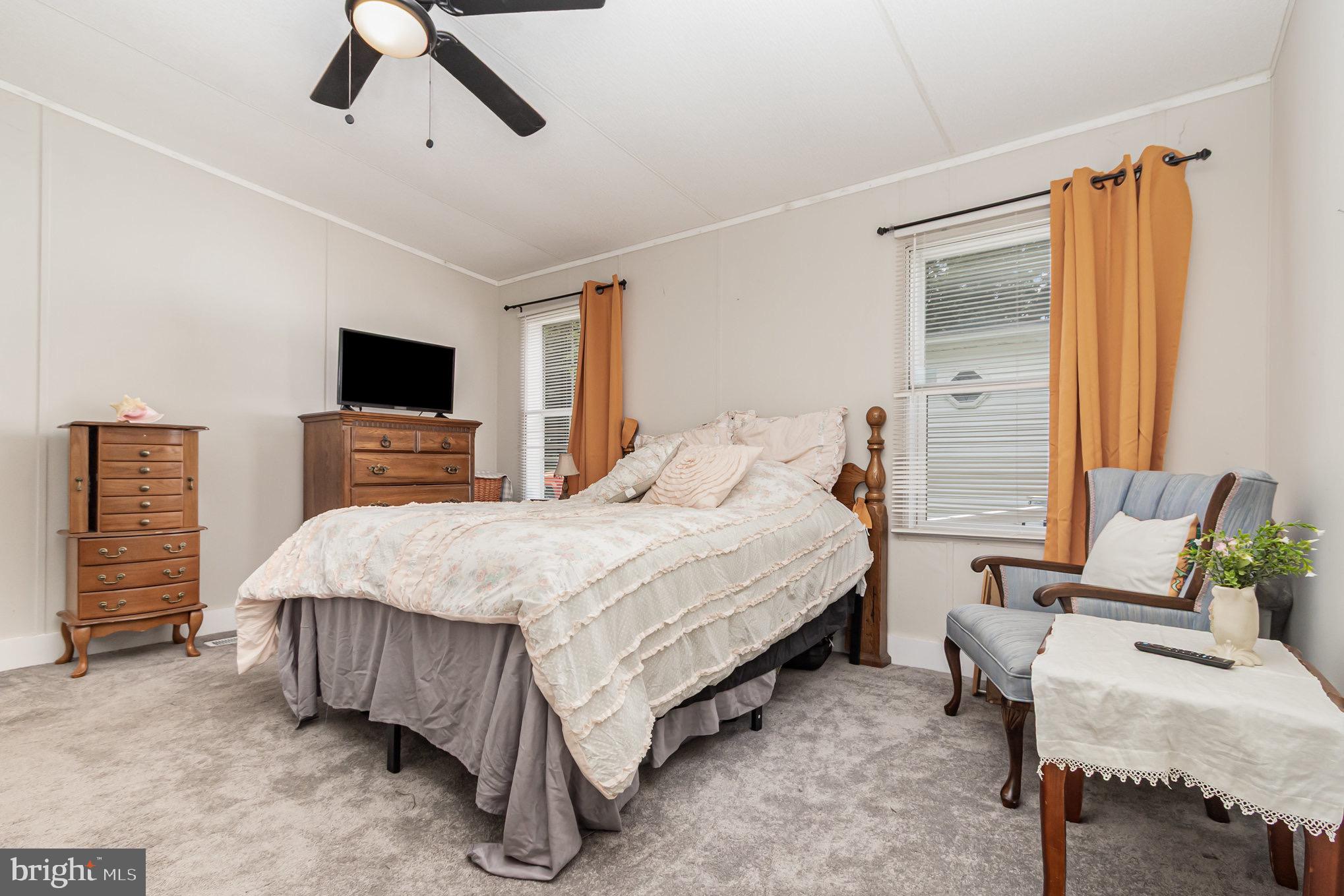 4041 Conowingo Road, Unit 30 Darlington, MD 21034 - Photo 19 of 40 a bedroom with a bed a couch and a flat tv screen