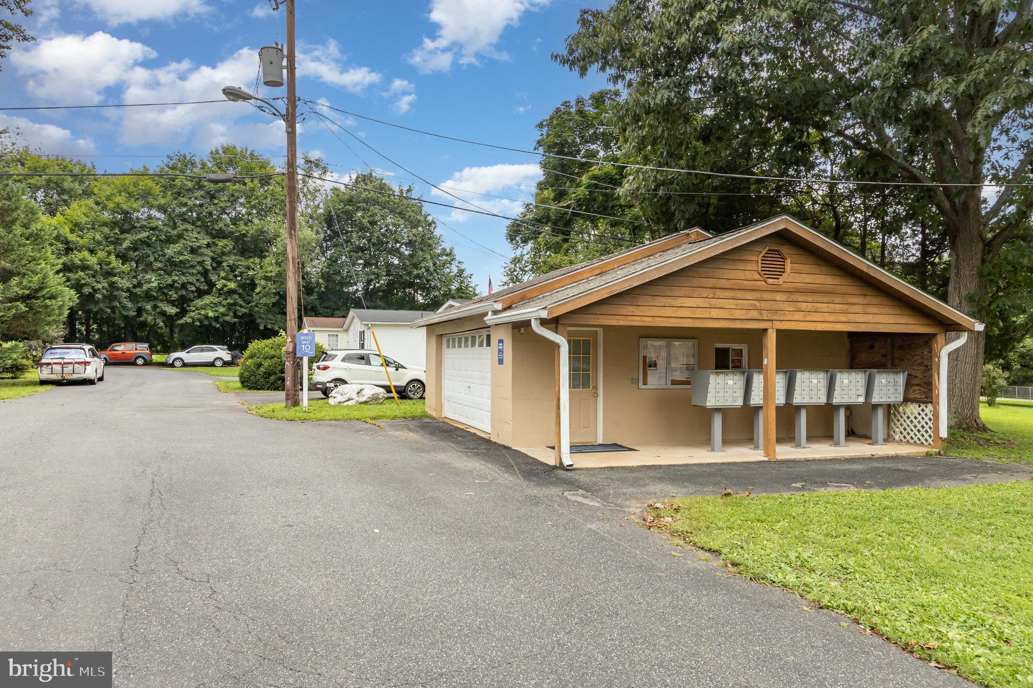 4041 Conowingo Road, Unit 30 Darlington, MD 21034 - Photo 2 of 40 a view of a house with a yard and potted plants