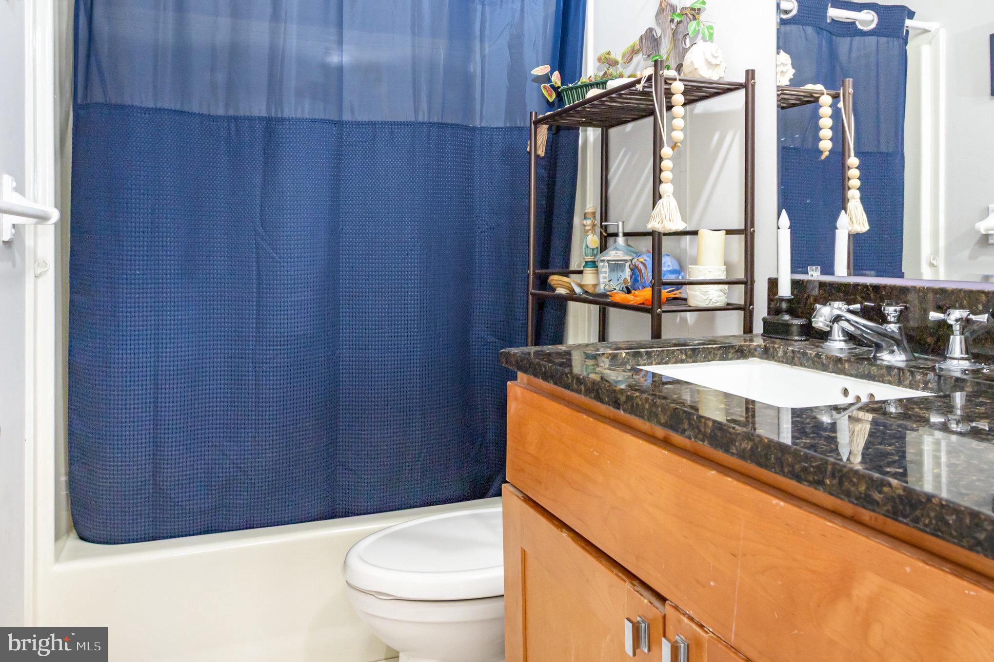 4041 Conowingo Road, Unit 30 Darlington, MD 21034 - Photo 23 of 40 a bathroom with a granite countertop sink toilet and a mirror