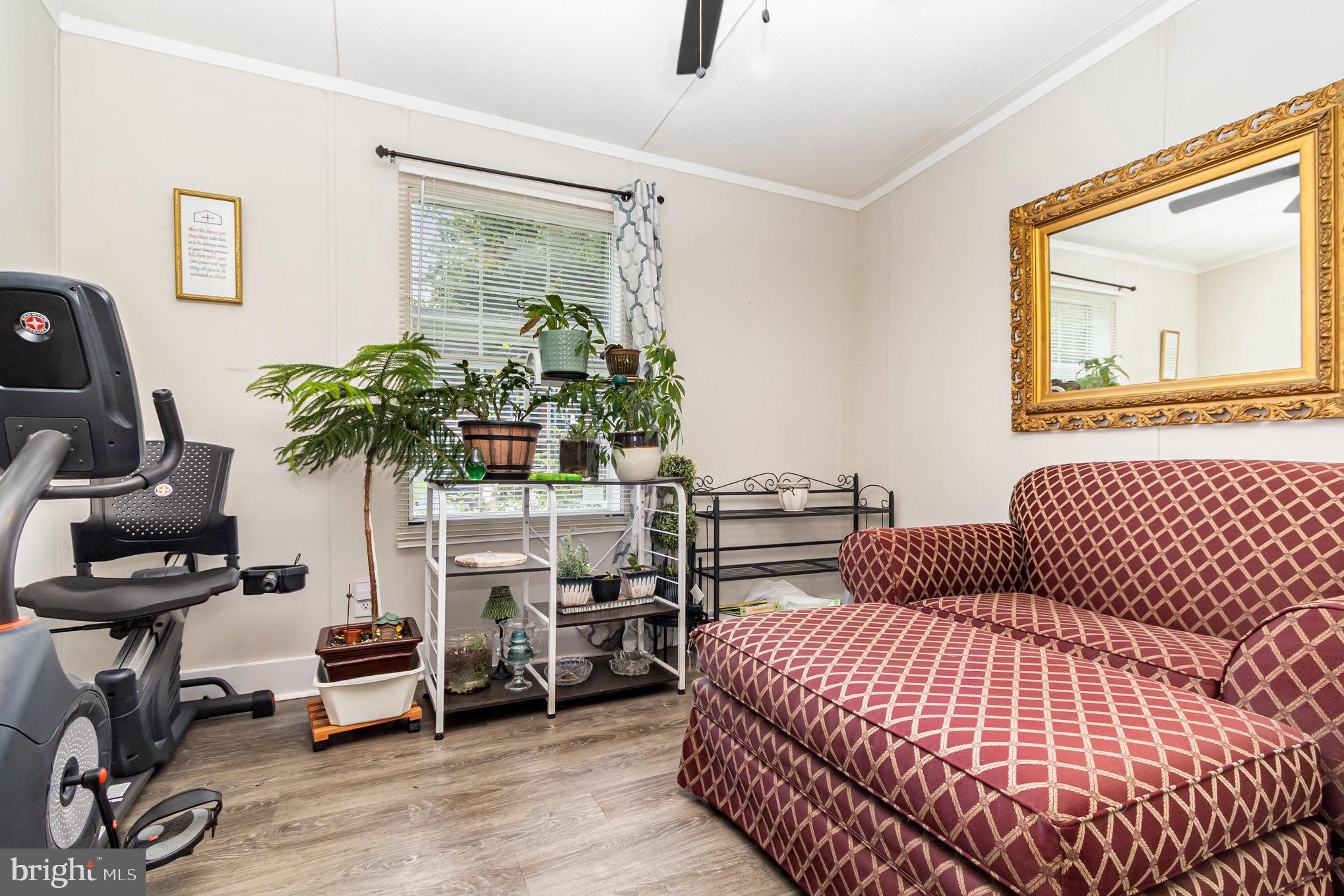 4041 Conowingo Road, Unit 30 Darlington, MD 21034 - Photo 24 of 40 a bedroom with a bed and a potted plant