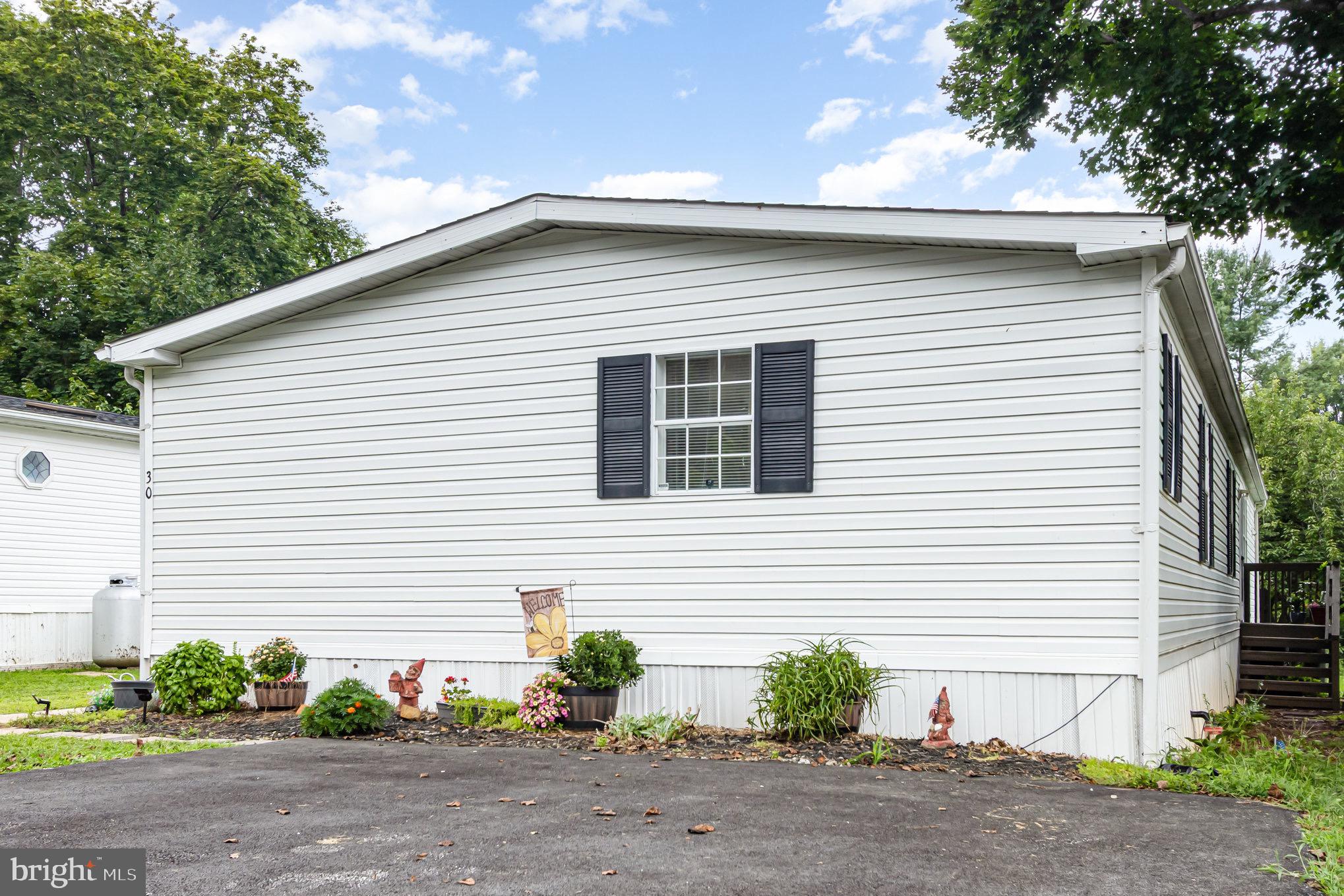 4041 Conowingo Road, Unit 30 Darlington, MD 21034 - Photo 33 of 40 a view of a house with a yard