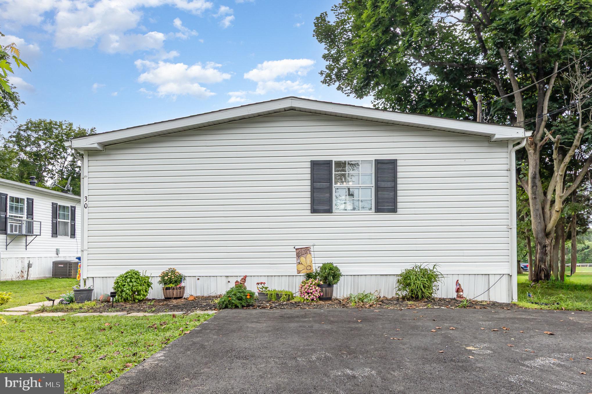 4041 Conowingo Road, Unit 30 Darlington, MD 21034 - Photo 35 of 40 a view of a house with a yard