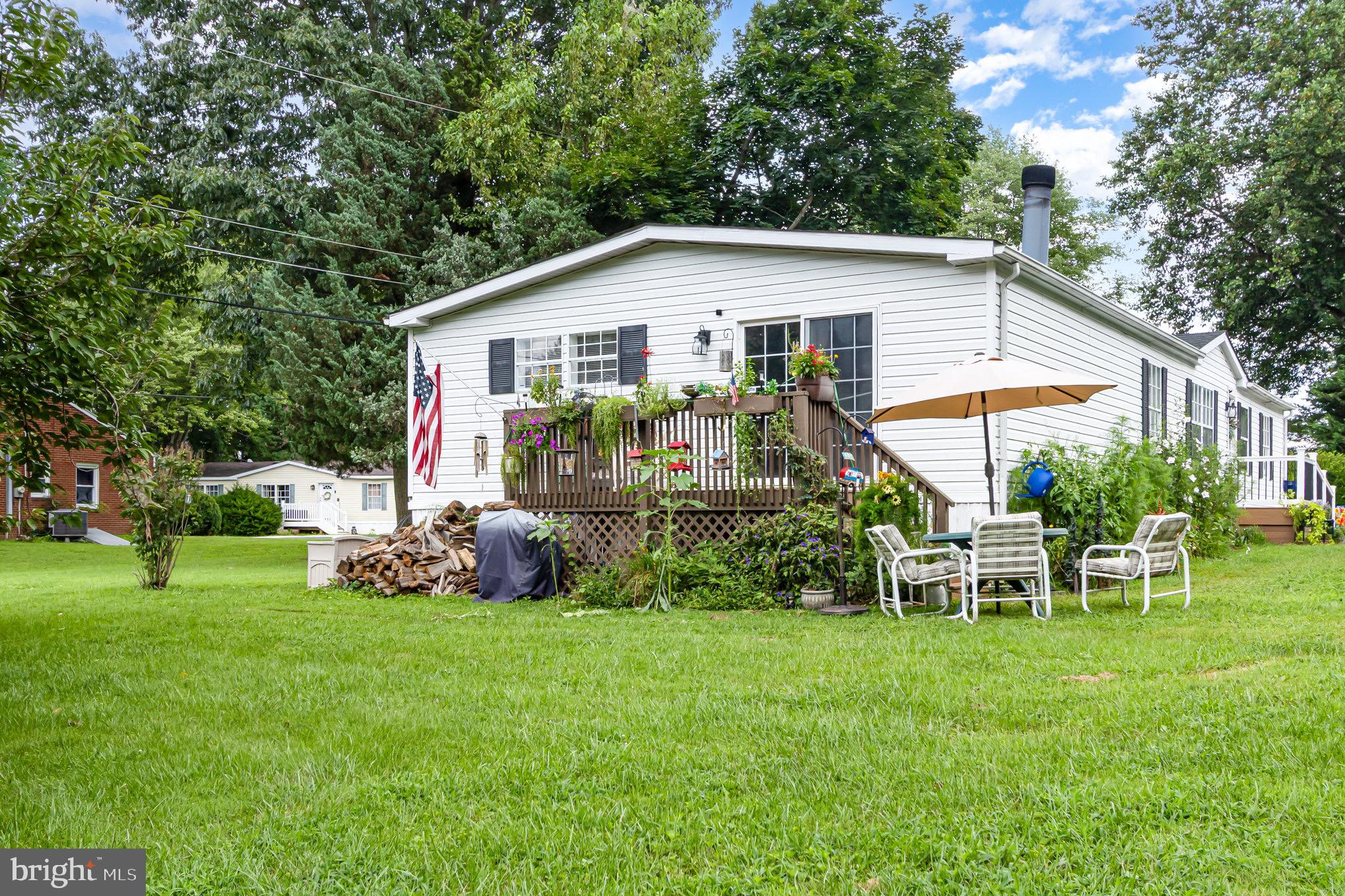 4041 Conowingo Road, Unit 30 Darlington, MD 21034 - Photo 36 of 40 a view of a house with a yard and sitting area