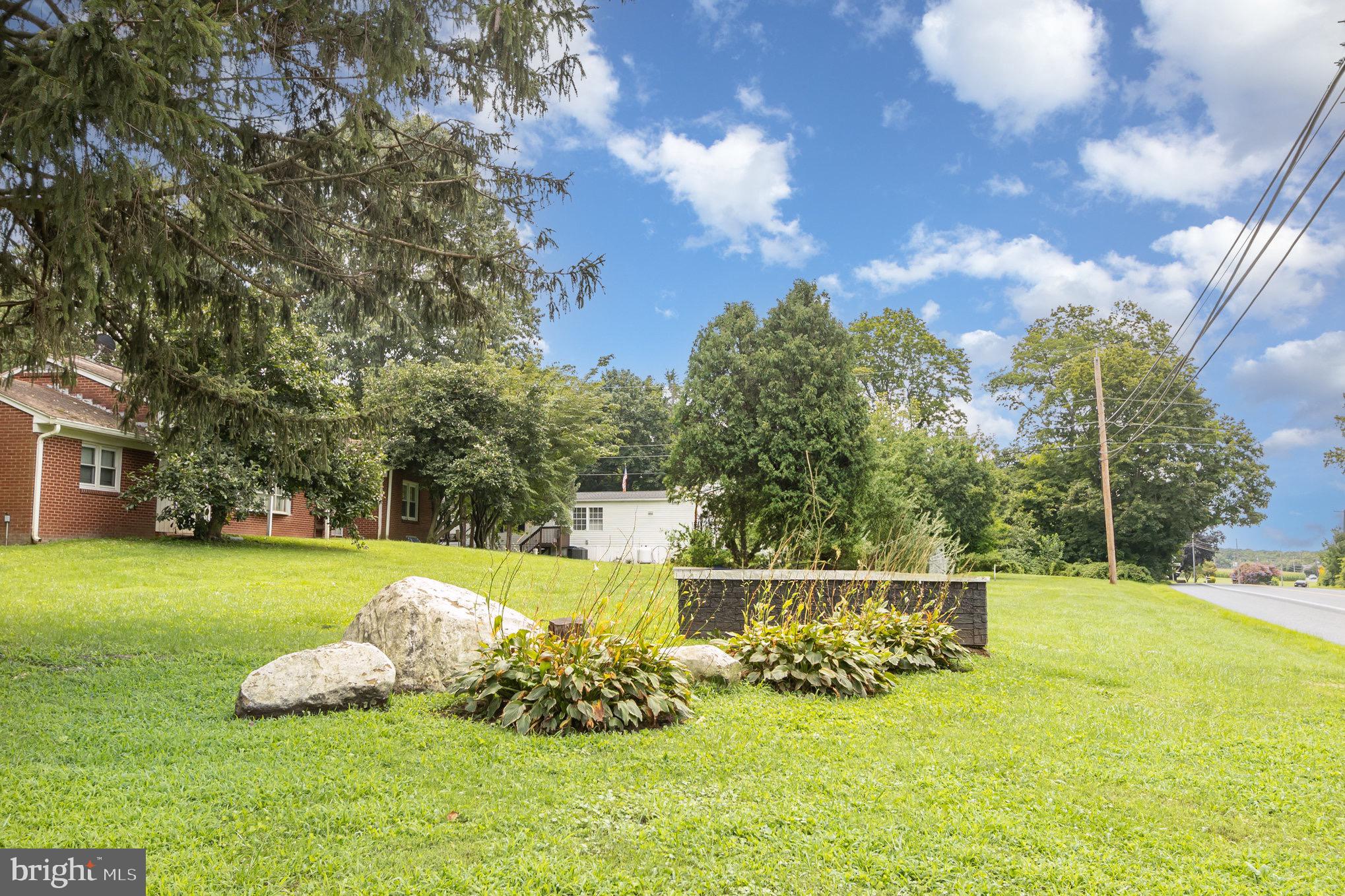 4041 Conowingo Road, Unit 30 Darlington, MD 21034 - Photo 37 of 40 a garden view with a sitting space