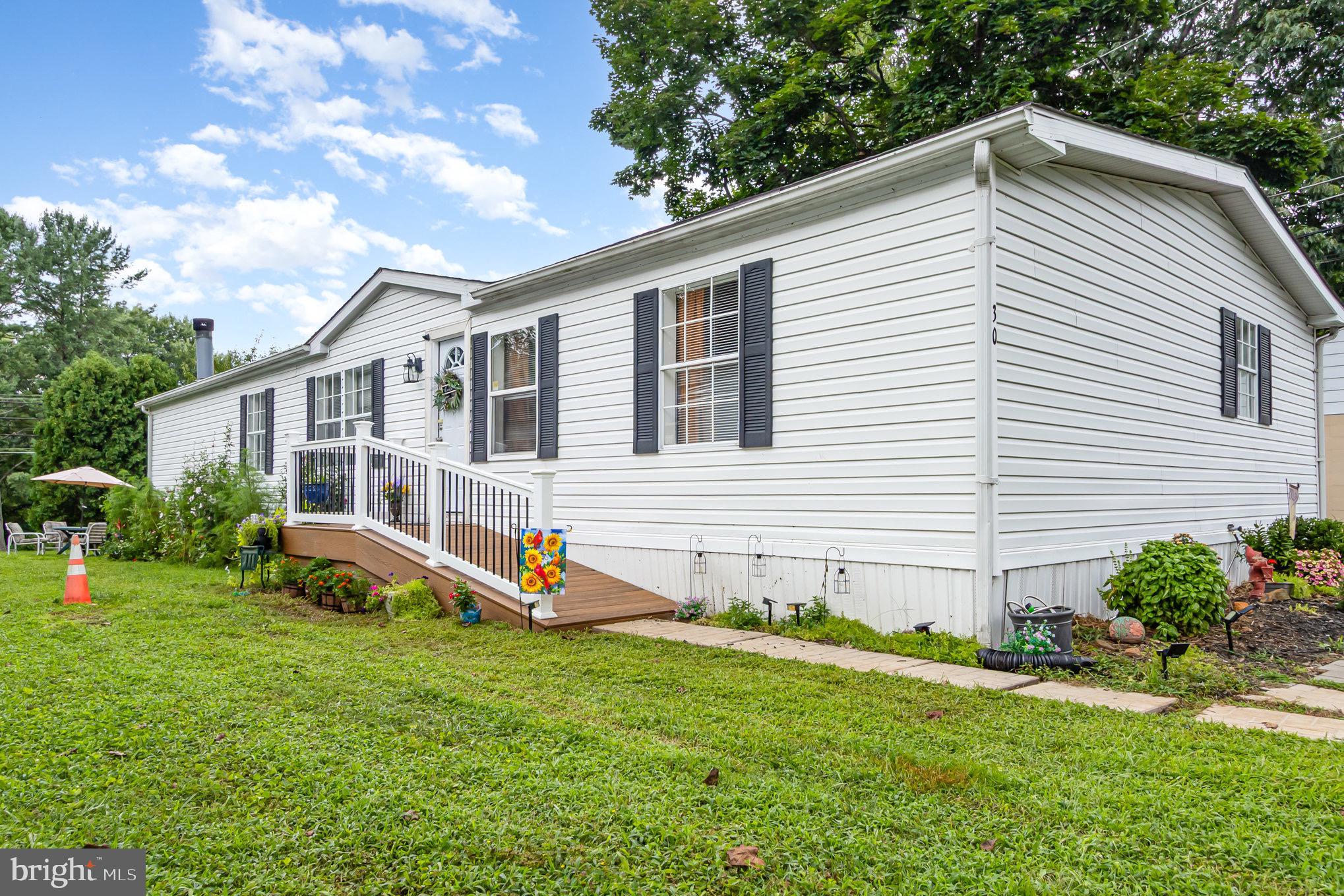4041 Conowingo Road, Unit 30 Darlington, MD 21034 - Photo 4 of 40 a view of a house with a yard and sitting area