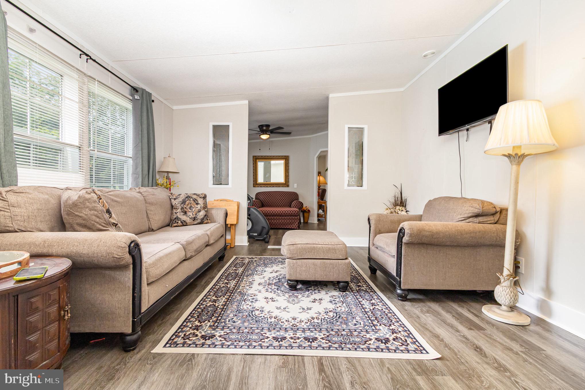 4041 Conowingo Road, Unit 30 Darlington, MD 21034 - Photo 7 of 40 a living room with furniture and a flat screen tv