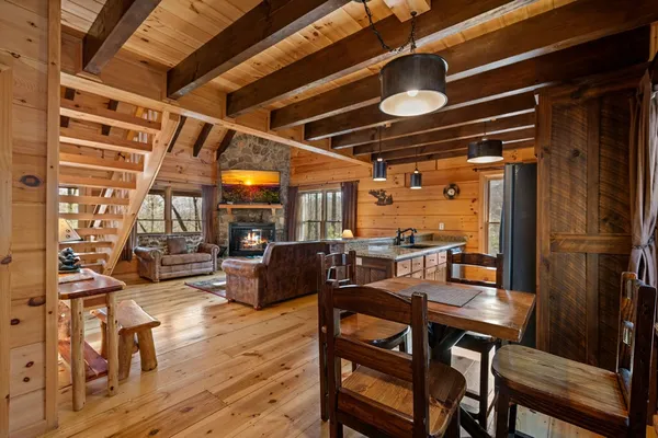 a living room with wooden floor and furniture