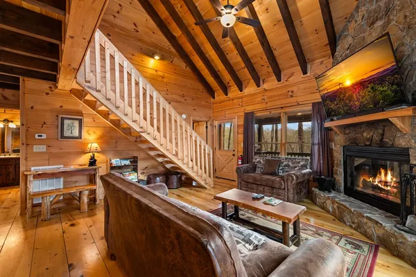 a bedroom with bed and a flat screen tv