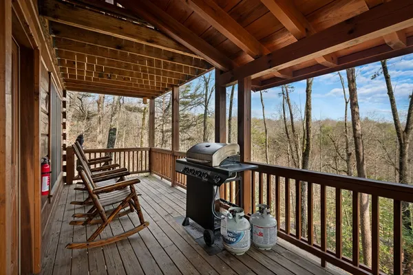 a room with pool table and windows
