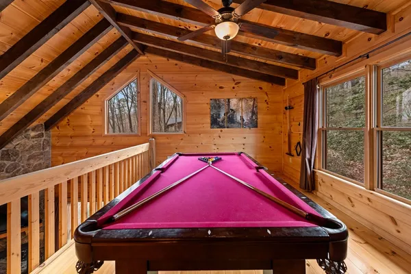 a view of swimming pool with outdoor seating