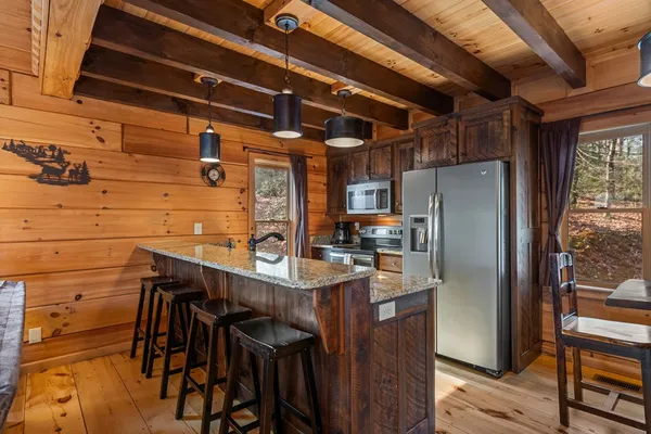 a living room with furniture a rug and a fireplace