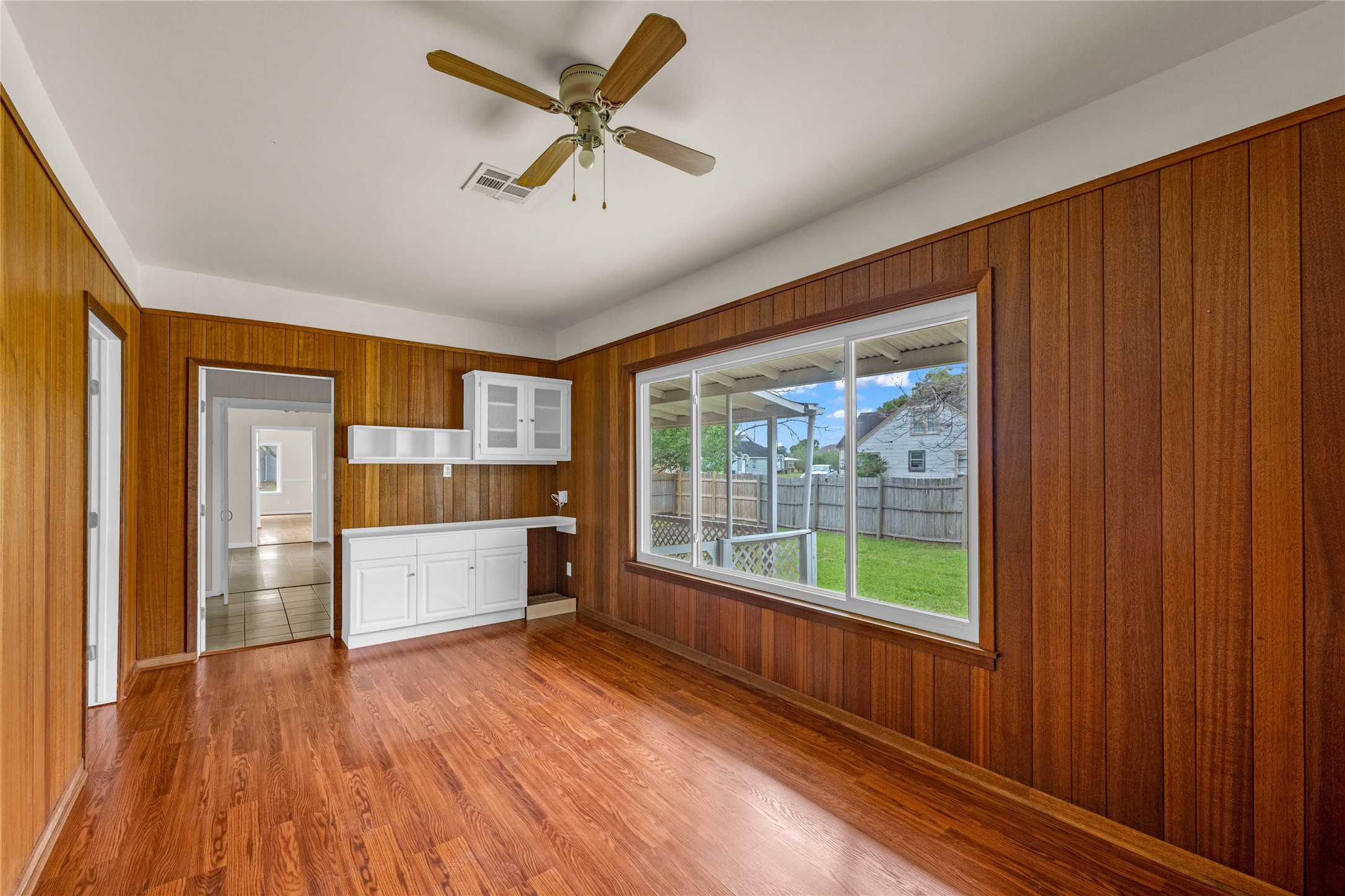 2527 Avenue G Rosenberg, TX 77471 - Photo 25 of 35 a large kitchen with a wooden floor and stainless steel appliances