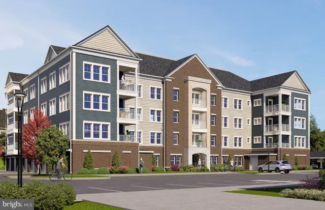 a front view of a building with a yard