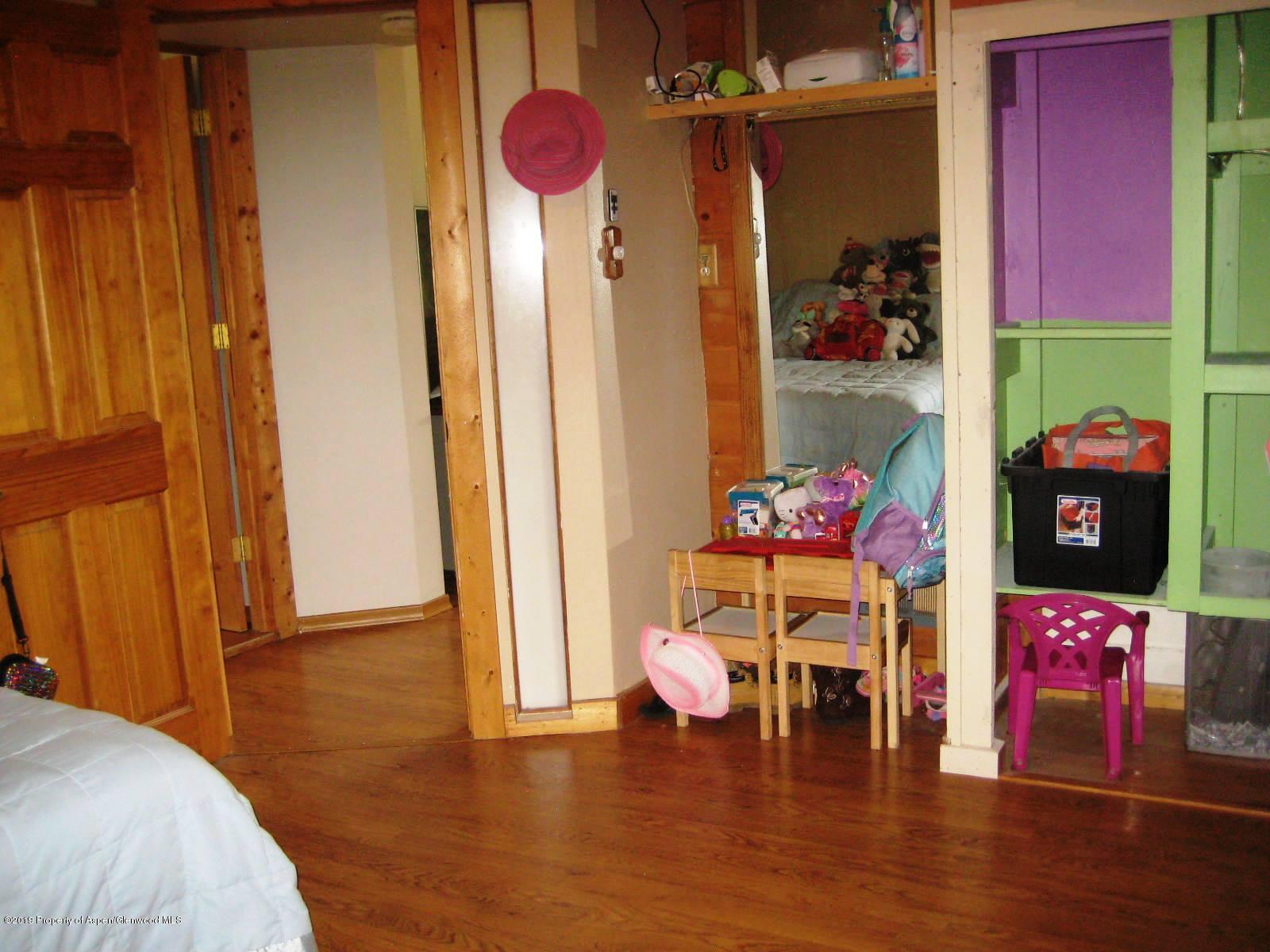 432 East 3rd Street Rifle, CO 81650 - Photo 13 of 20 a living room with furniture and a table with wooden floor