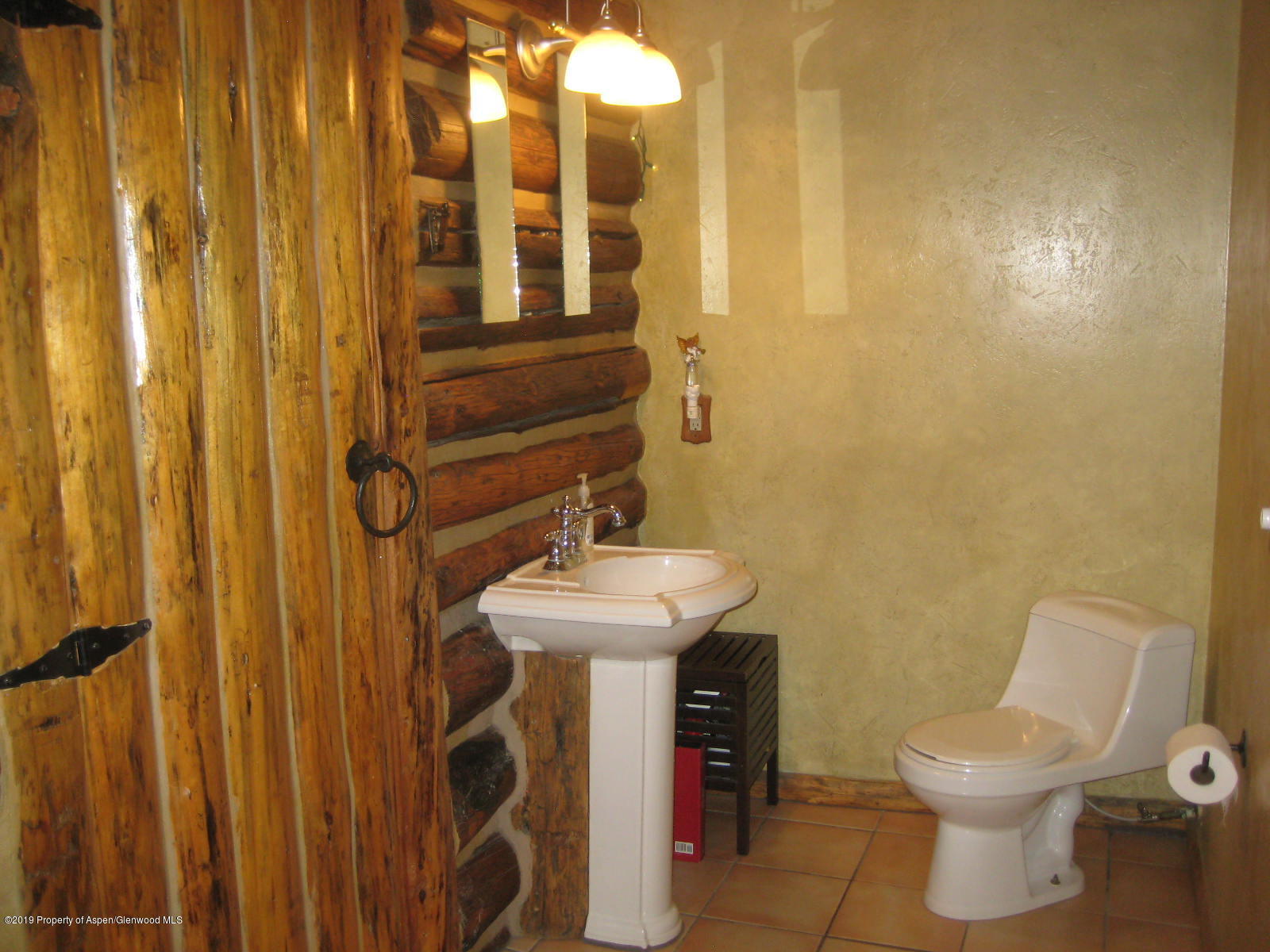 432 East 3rd Street Rifle, CO 81650 - Photo 15 of 20 a bathroom with a sink a toilet and shower