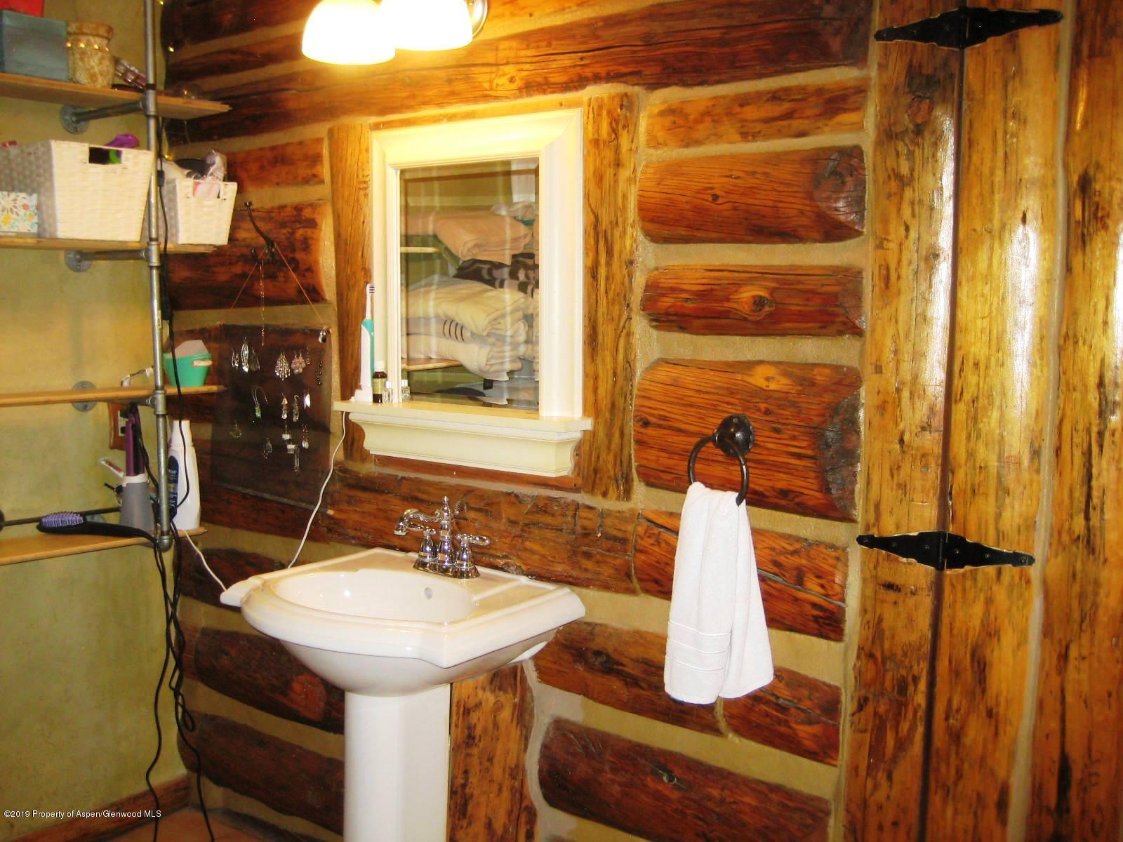 432 East 3rd Street Rifle, CO 81650 - Photo 16 of 20 a bathroom with a sink and a mirror