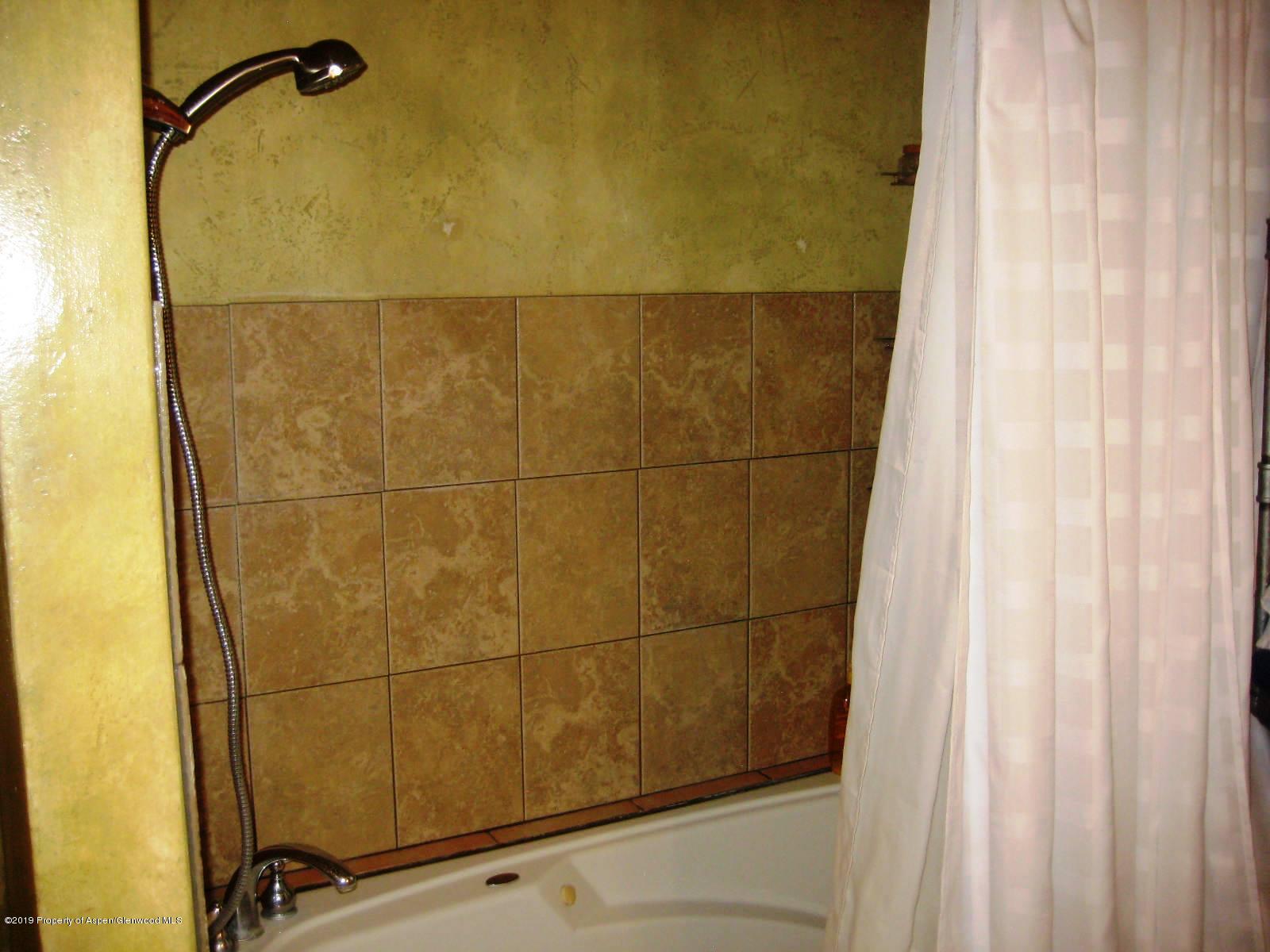 432 East 3rd Street Rifle, CO 81650 - Photo 17 of 20 a bathroom with a shower