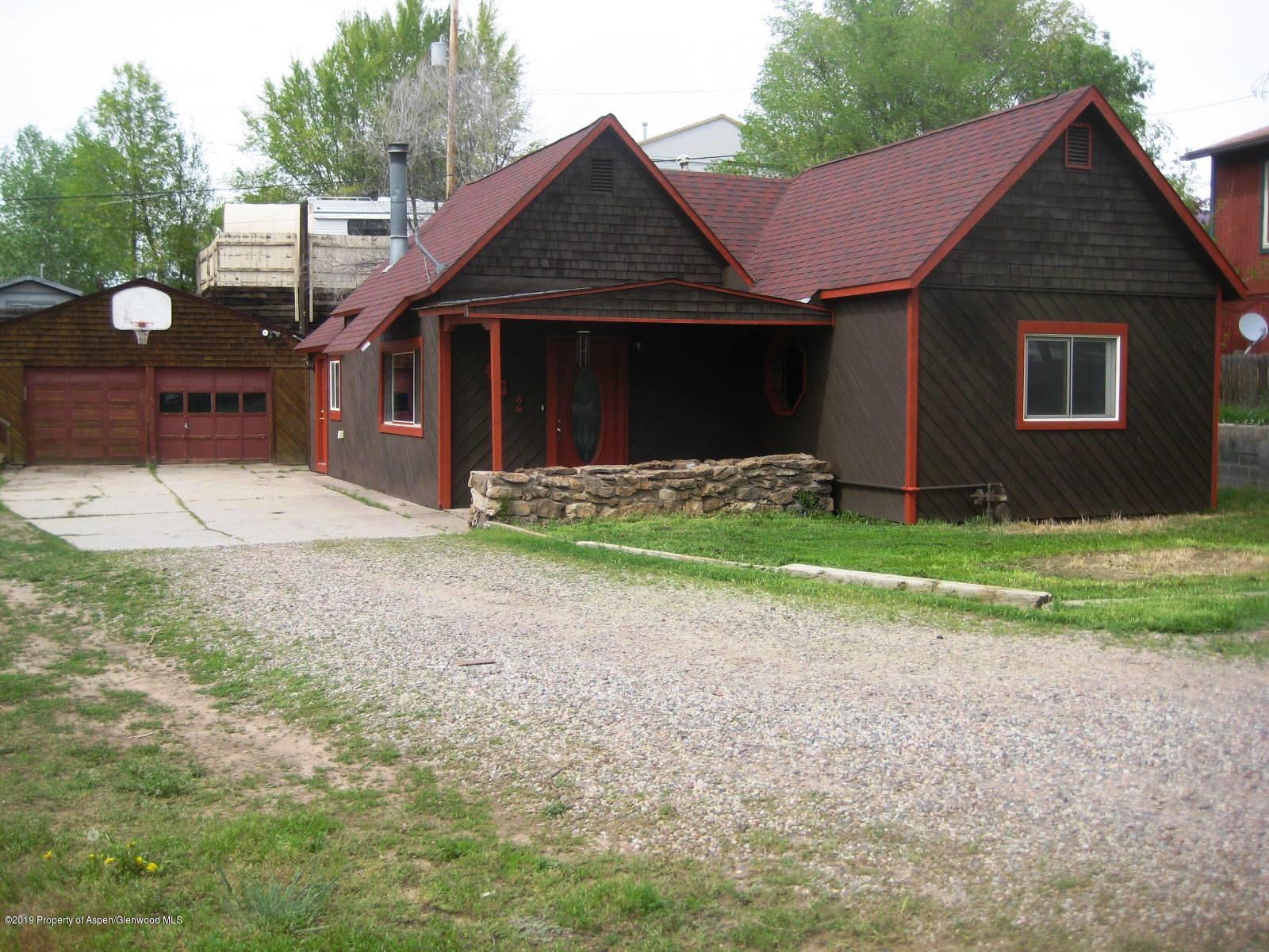 432 East 3rd Street Rifle, CO 81650 - Photo 3 of 20 a front view of a house with garden