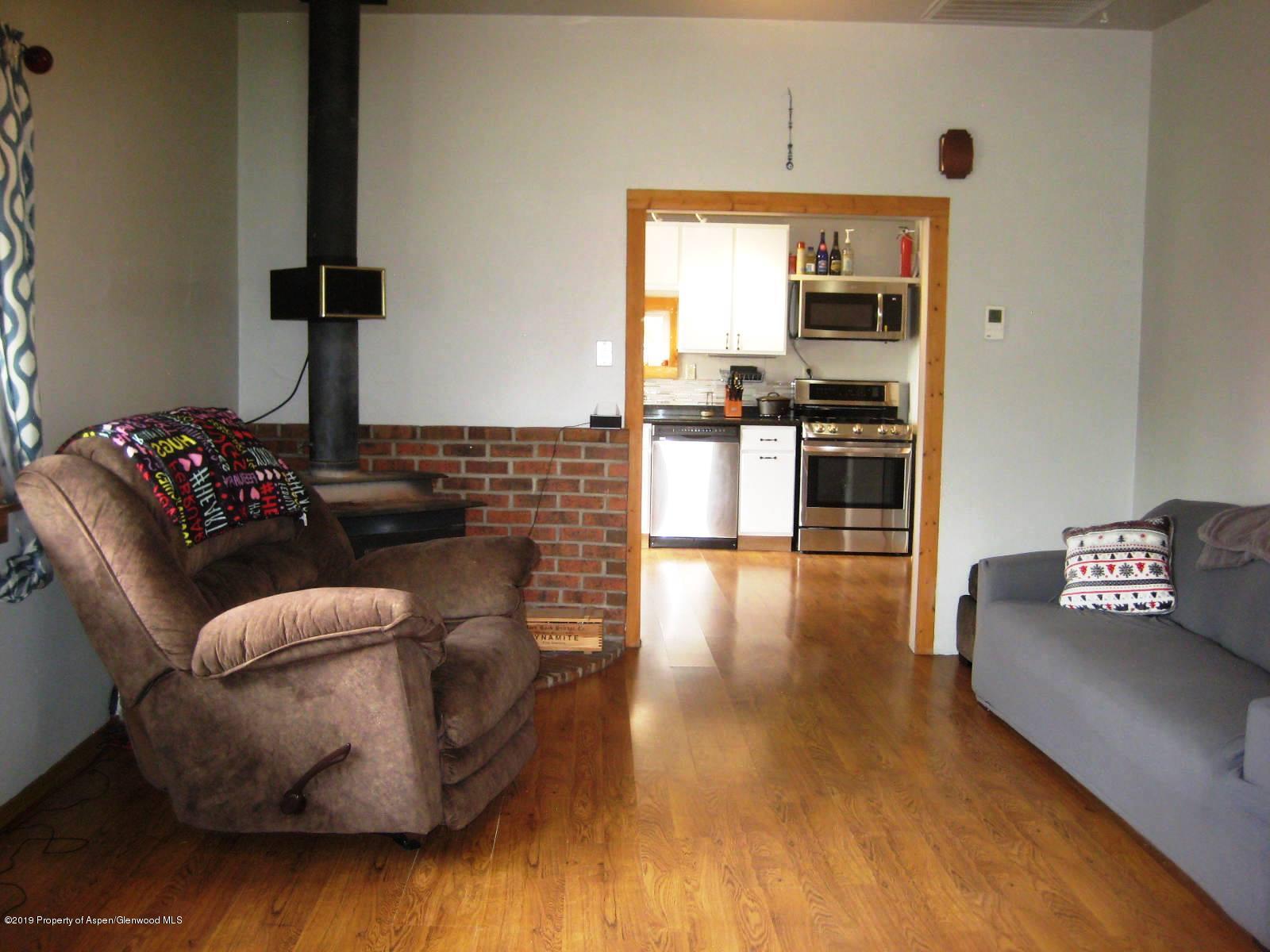 432 East 3rd Street Rifle, CO 81650 - Photo 8 of 20 a living room with furniture and kitchen view