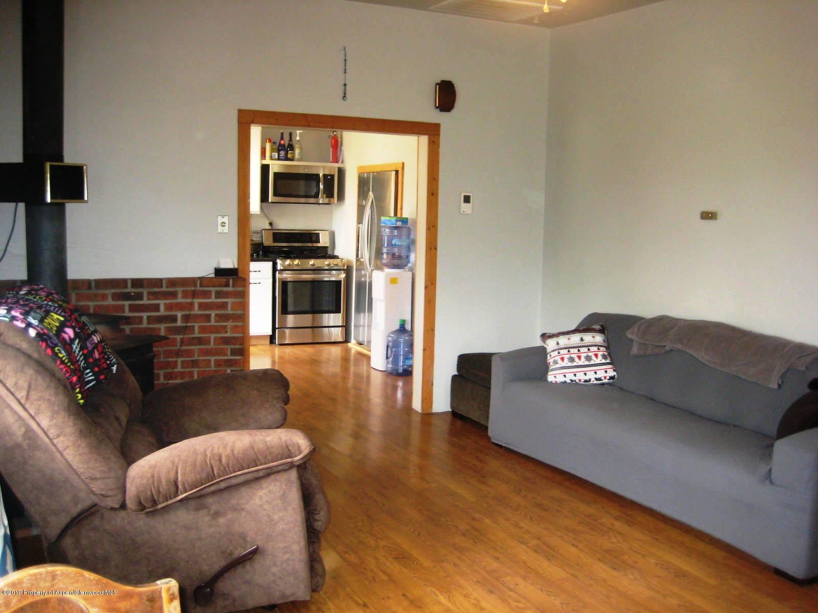 432 East 3rd Street Rifle, CO 81650 - Photo 9 of 20 a living room with furniture fireplace and flat screen tv
