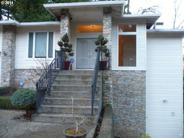 4403 West Burnside Road Portland, OR 97210 - Photo 3 of 16 a front view of a house with stairs