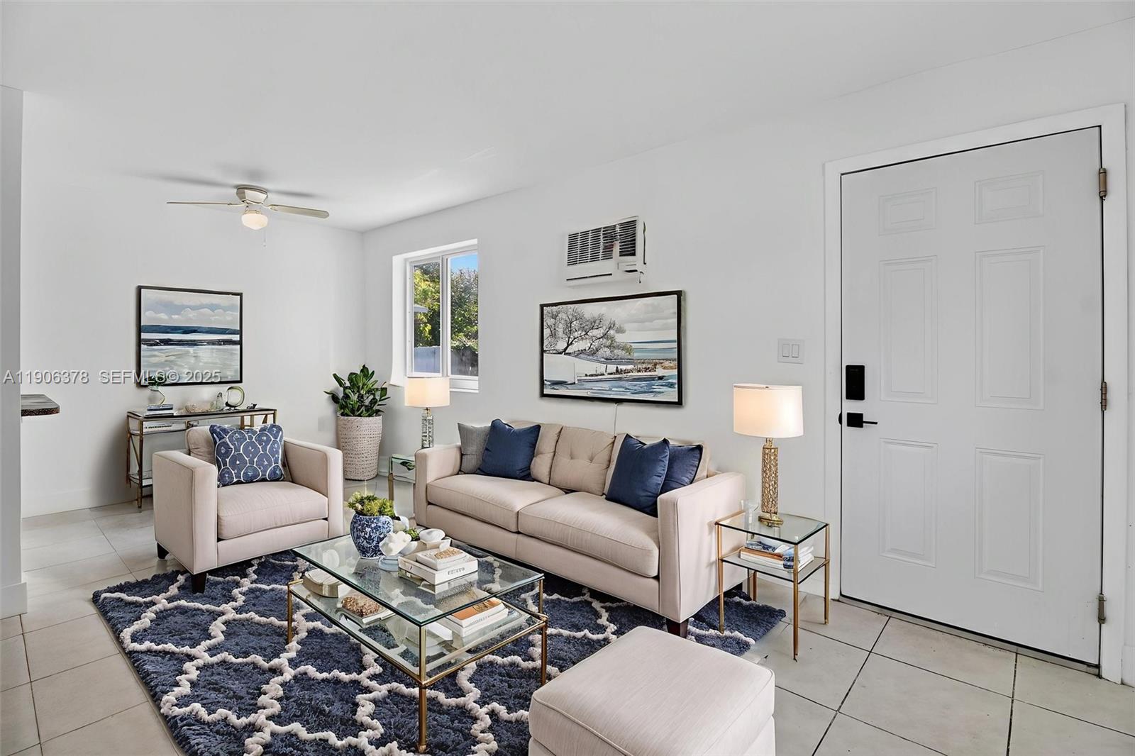 a living room with furniture and a rug