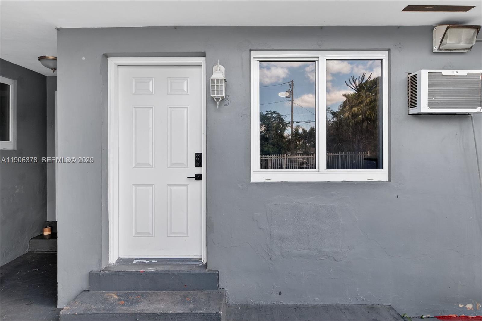 1864 Northwest 28th Street, Unit 1 Miami, FL 33142 - Photo 14 of 16 a view of a door and a window