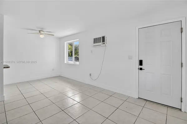 a view of an empty room with a window