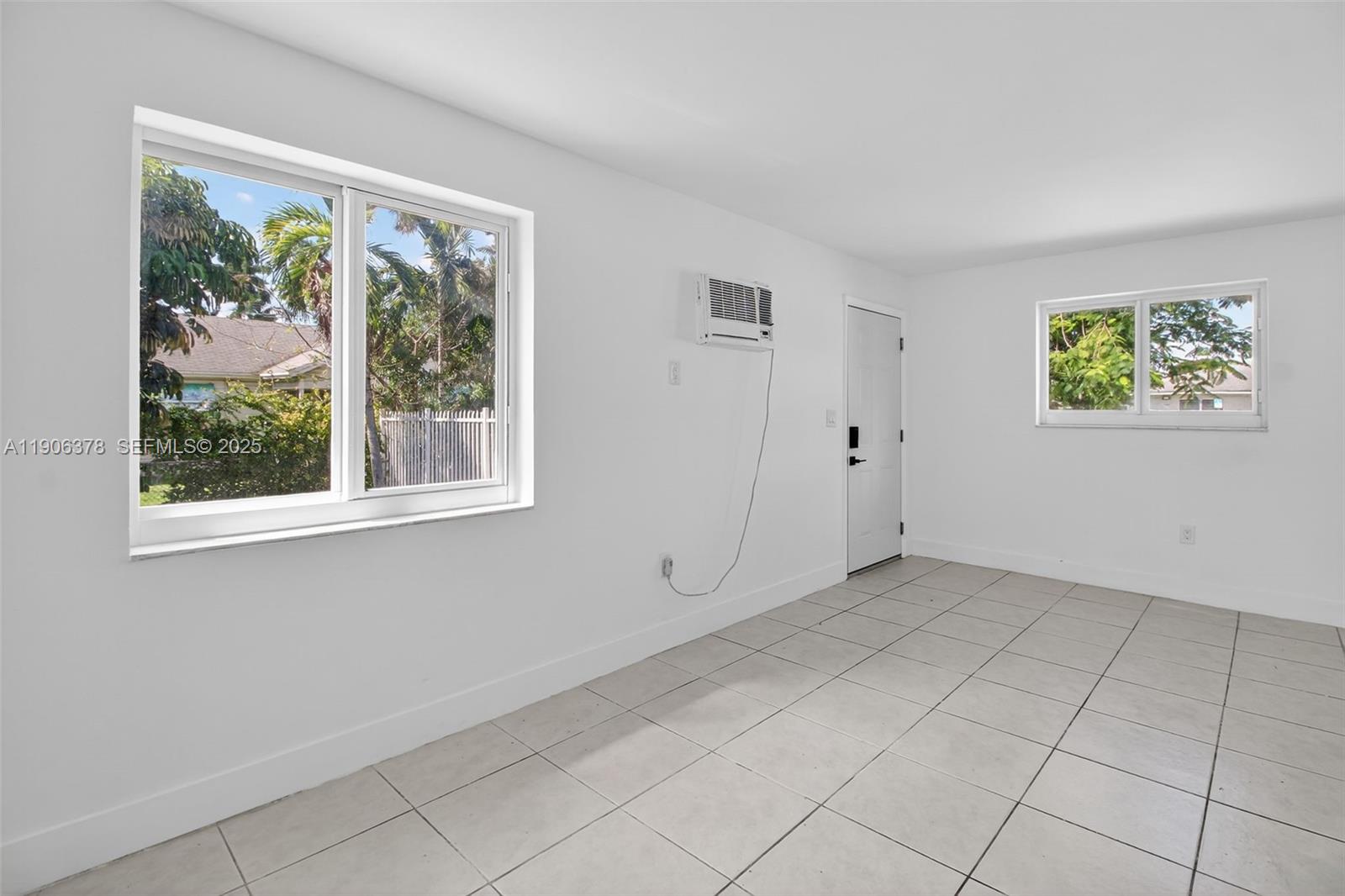 1864 Northwest 28th Street, Unit 1 Miami, FL 33142 - Photo 3 of 16 an empty room with windows