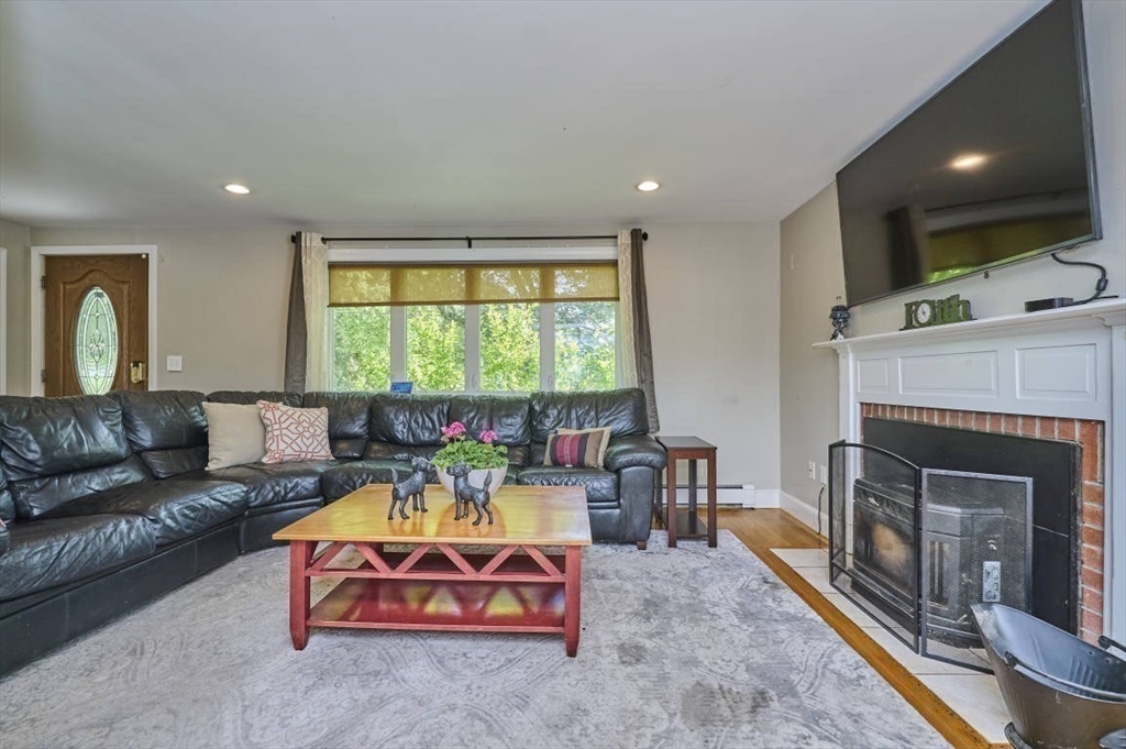 7 Lasallette Road Billerica, MA 01821 - Photo 14 of 35 a living room with furniture and a fireplace