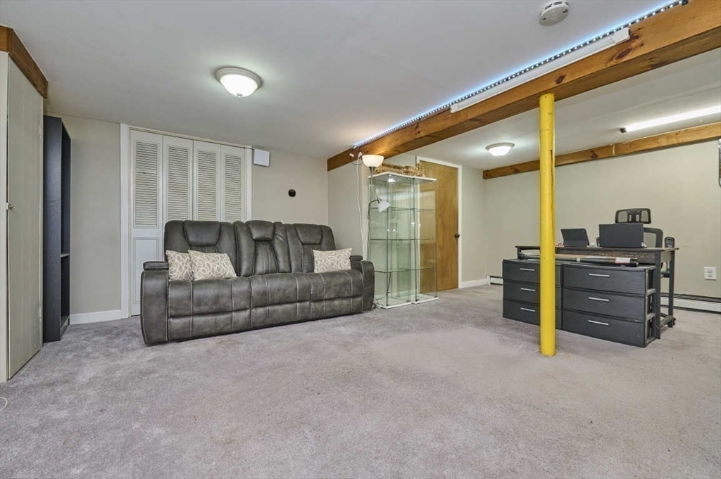 7 Lasallette Road Billerica, MA 01821 - Photo 26 of 35 a living room with furniture and a flat screen tv