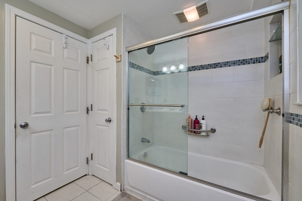 7 Lasallette Road Billerica, MA 01821 - Photo 27 of 35 a bathroom with a bathtub and a shower