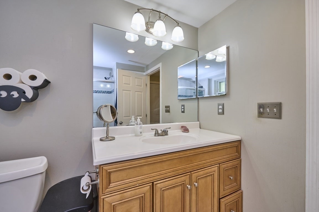 7 Lasallette Road Billerica, MA 01821 - Photo 28 of 35 a bathroom with a sink a vanity and a mirror
