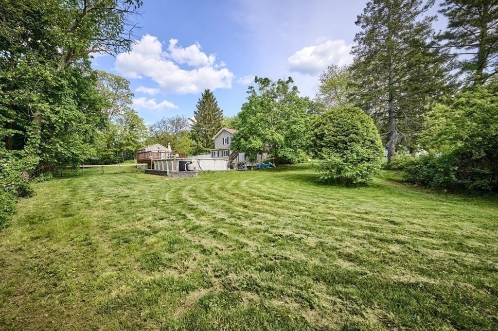 7 Lasallette Road Billerica, MA 01821 - Photo 33 of 35 a view of a garden with a bench