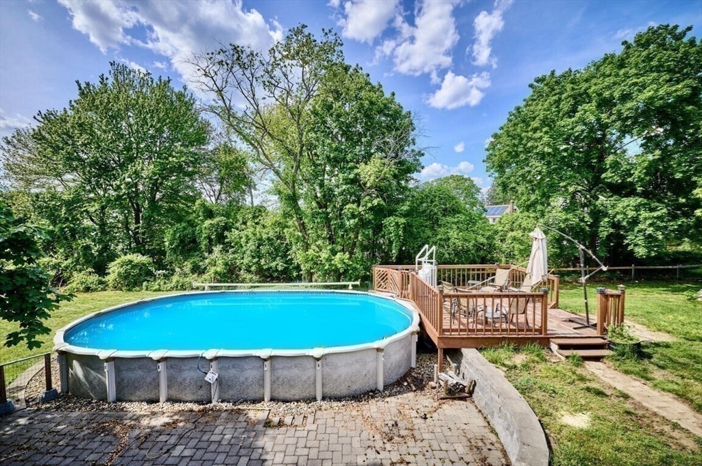 7 Lasallette Road Billerica, MA 01821 - Photo 4 of 35 a view of a chair and table in the backyard