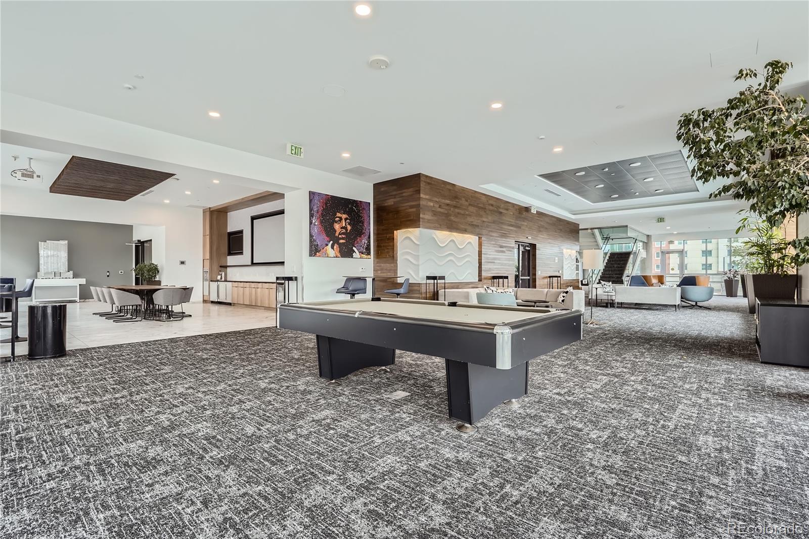 891 14th Street, Unit 2205 Denver, CO 80202 - Photo 16 of 22 a living room with furniture a rug and a kitchen