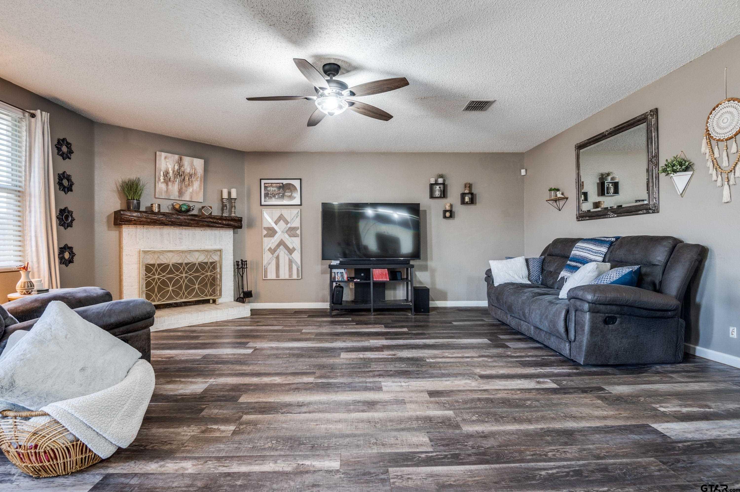 2748 Cameron Way Mesquite, TX 75181 - Photo 5 of 25 a living room with furniture and a fireplace