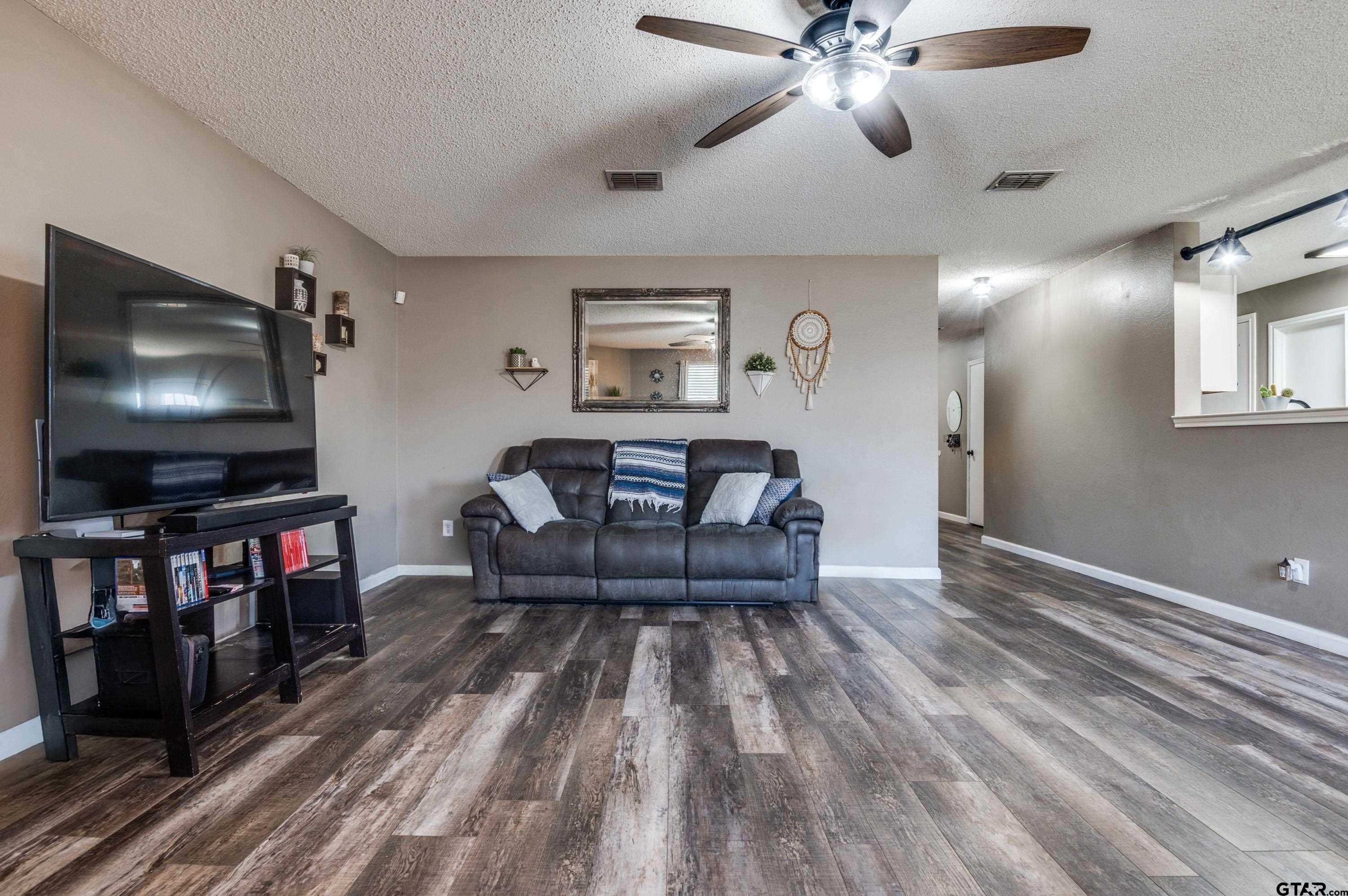 2748 Cameron Way Mesquite, TX 75181 - Photo 8 of 25 a living room with furniture and a flat screen tv
