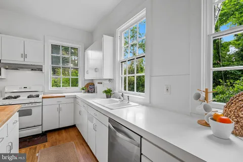 a bathroom with a sink and a window