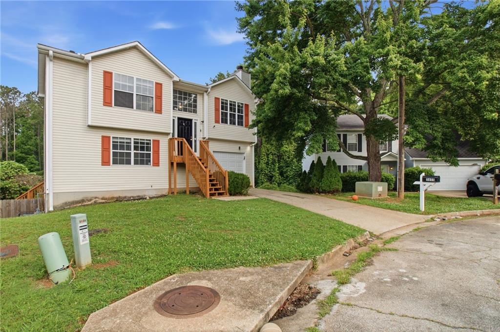 5855 Crescent Ridge Court Lithonia, GA 30058 - Photo 3 of 46 a view of a house with a backyard