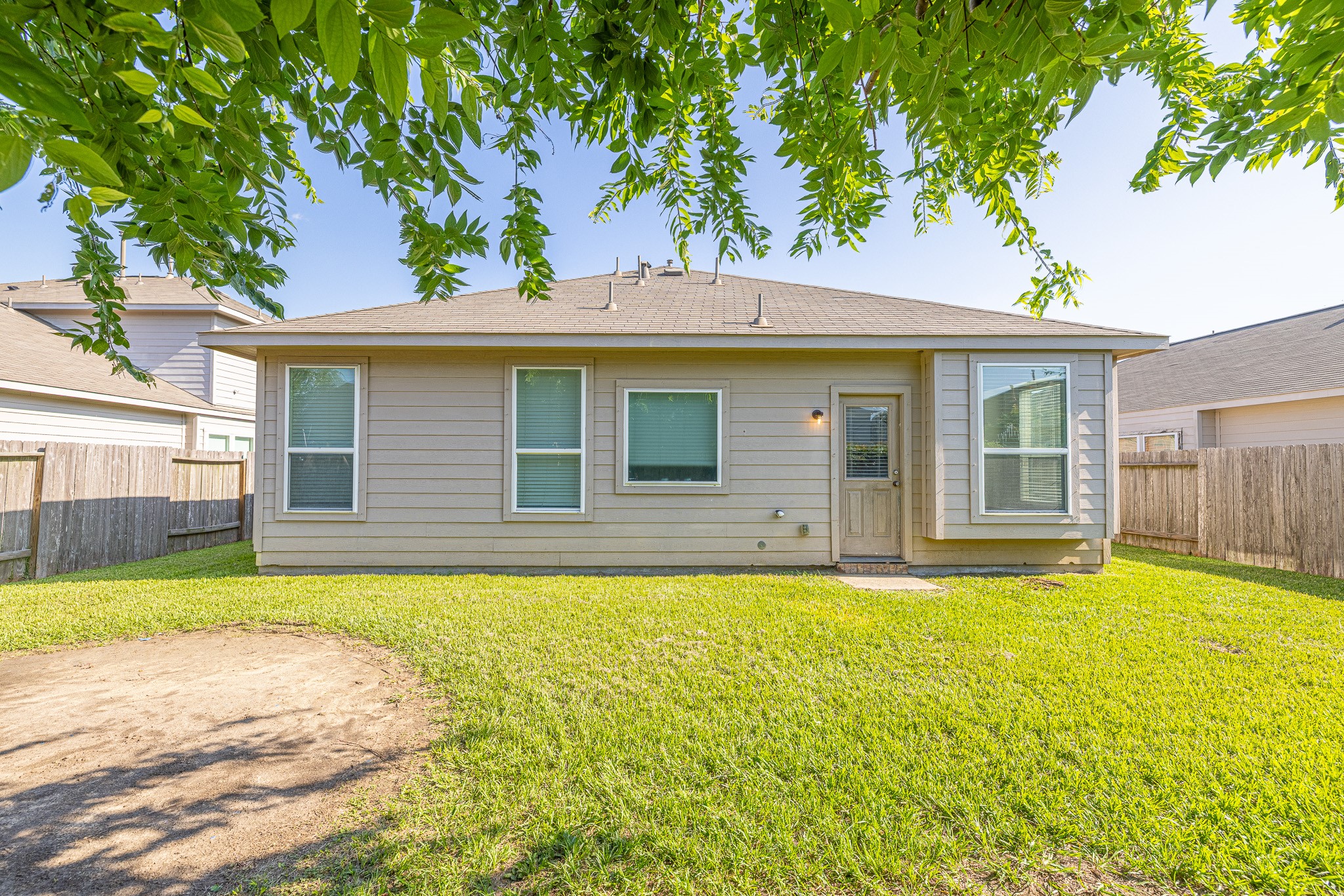 3818 Hunters Trail Baytown, TX 77521 - Photo 29 of 32 a front view of a house with a yard