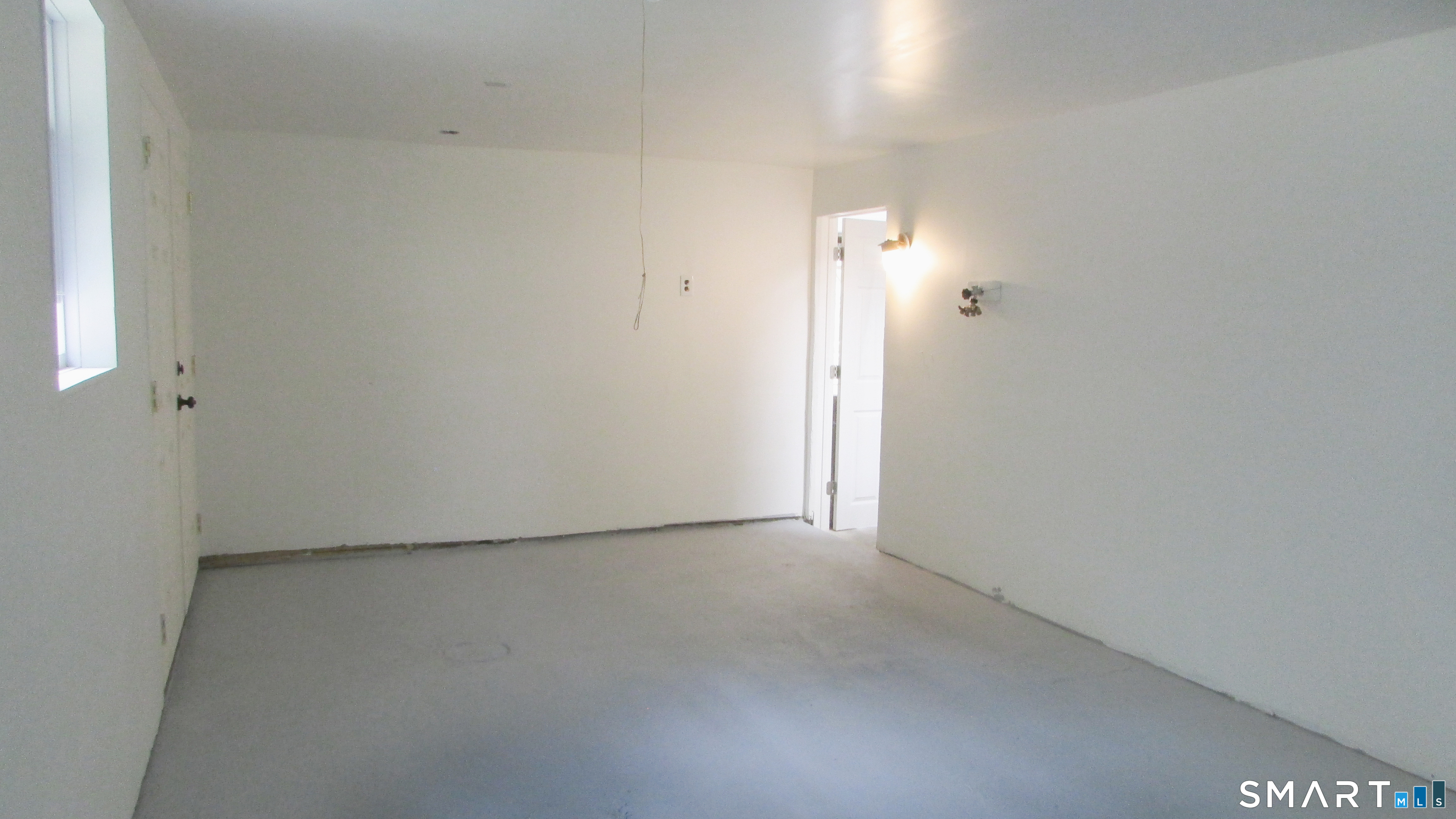 410 Pumpkin Hill Road Ledyard, CT 06339 - Photo 22 of 25 Additional room in the walk-out basement. (opposite angle)
