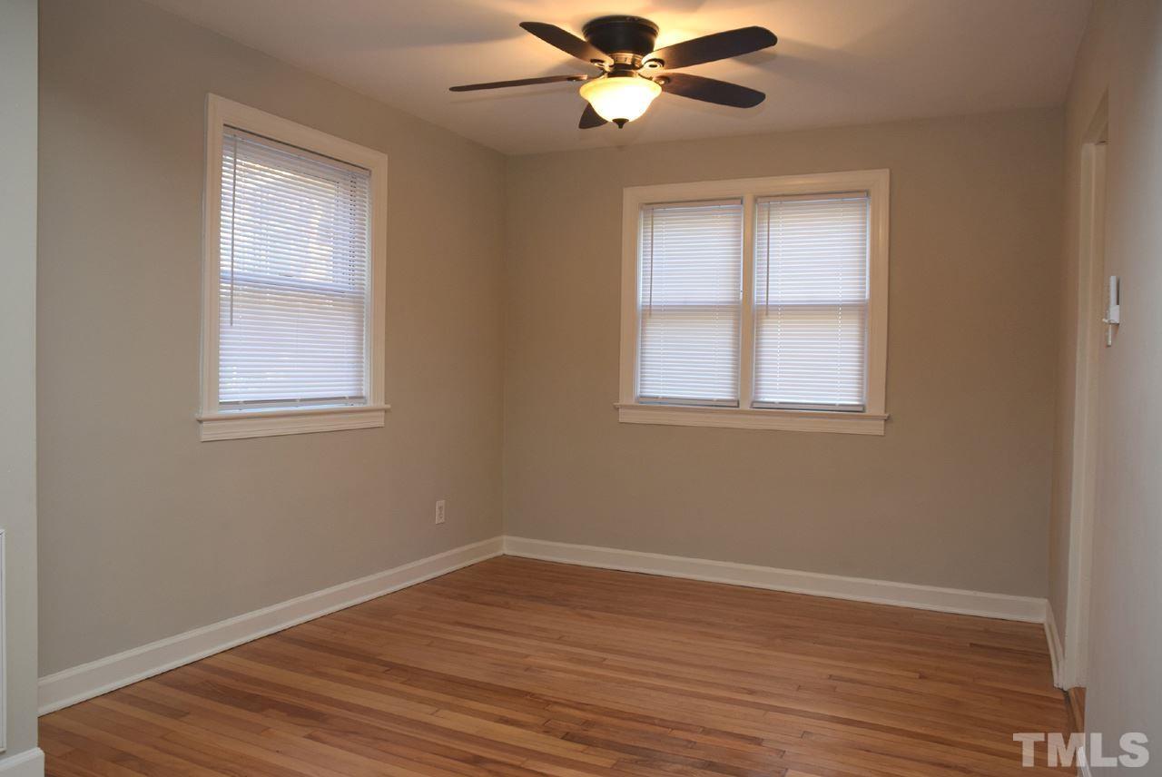 1057 Nichols Drive Raleigh, NC 27605 - Photo 11 of 39 a view of an empty room with wooden floor and a window