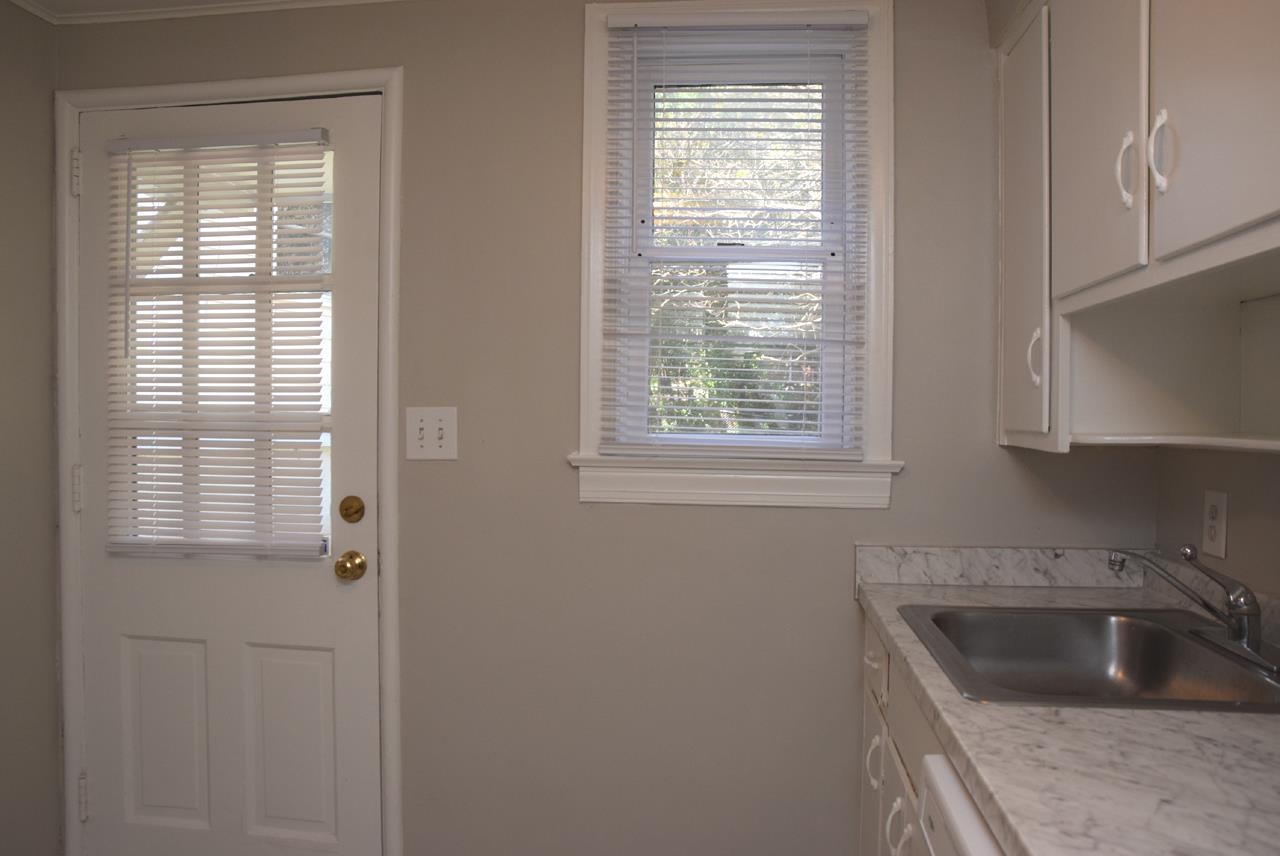 1057 Nichols Drive Raleigh, NC 27605 - Photo 17 of 39 a kitchen with a sink and cabinets