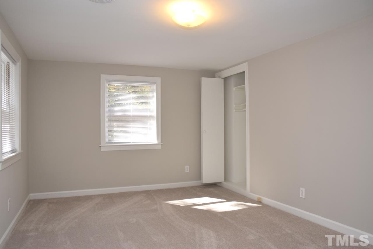1057 Nichols Drive Raleigh, NC 27605 - Photo 18 of 39 an empty room with windows