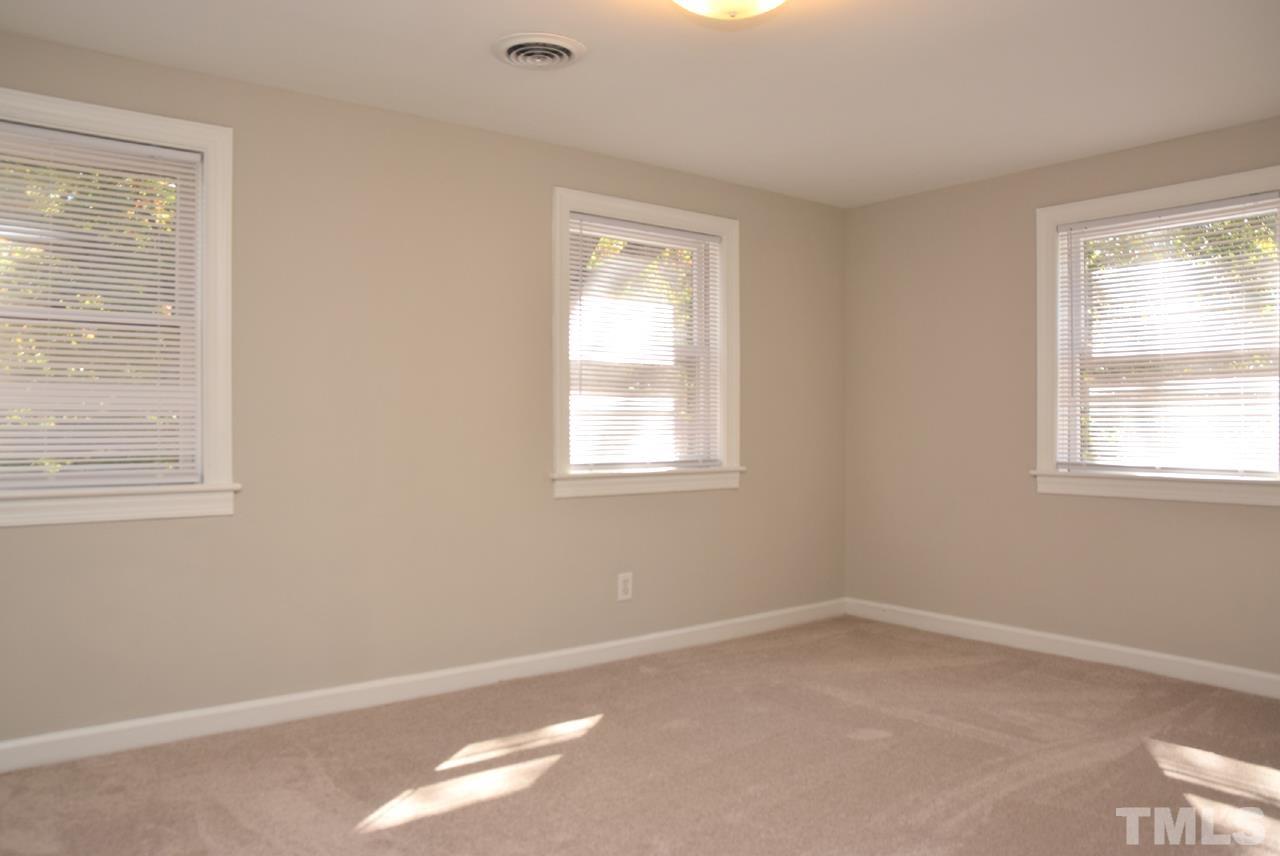 1057 Nichols Drive Raleigh, NC 27605 - Photo 19 of 39 an empty room with a window