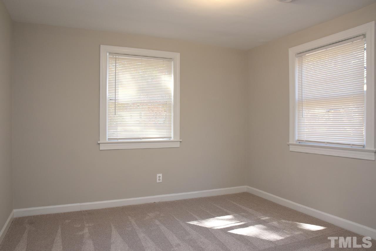 1057 Nichols Drive Raleigh, NC 27605 - Photo 22 of 39 an empty room with a window