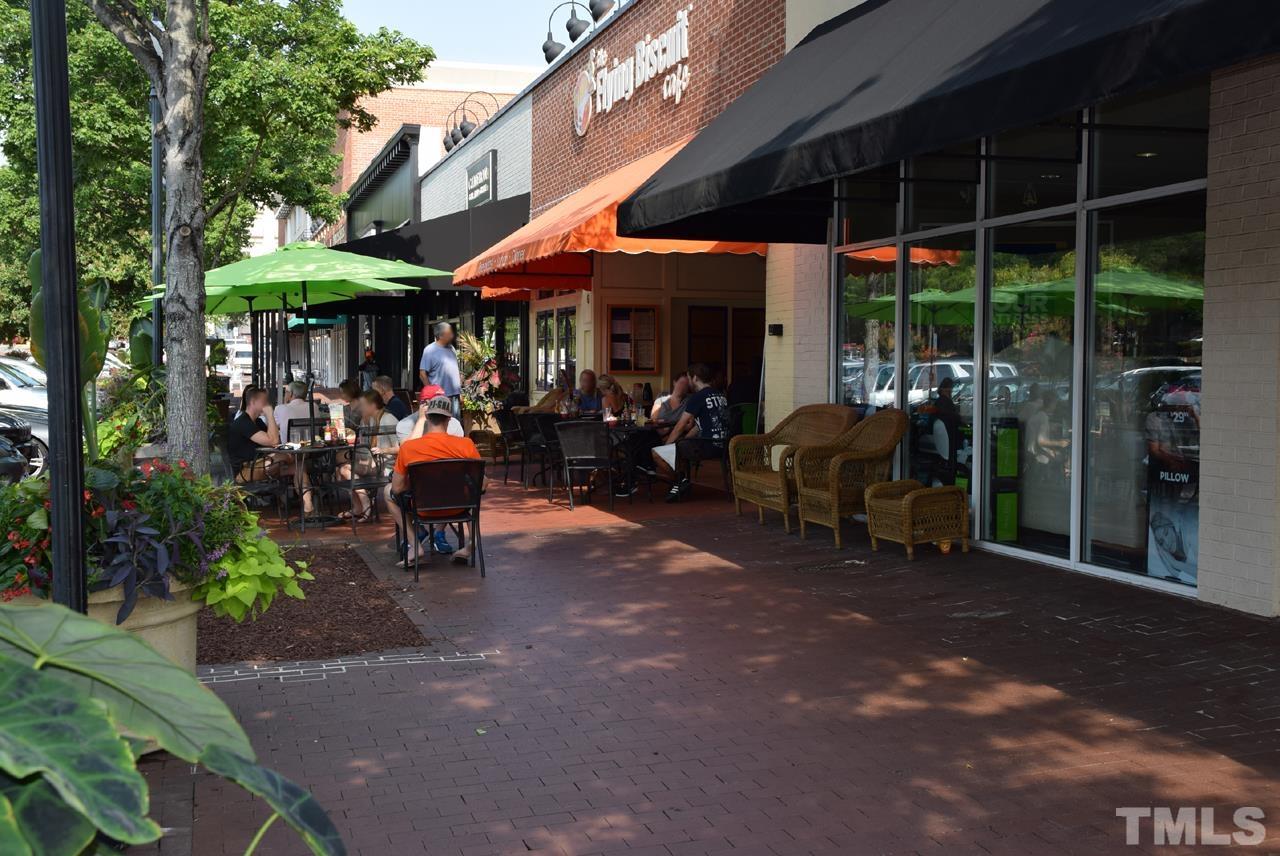 1057 Nichols Drive Raleigh, NC 27605 - Photo 30 of 39 a view of people sitting in front of retail shop